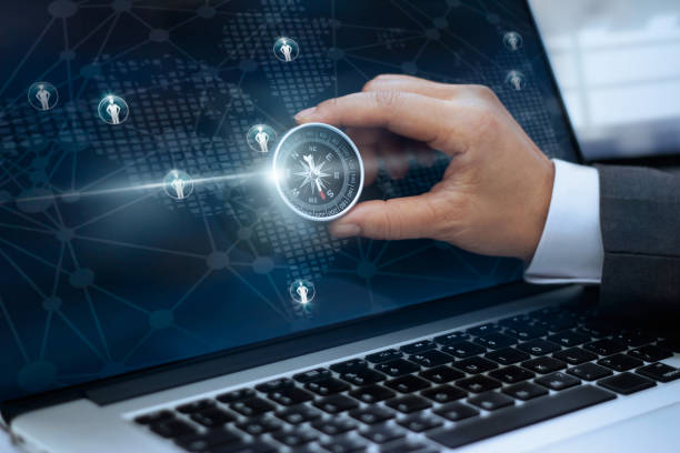 istock Businessman with a compass holding in hand and icon customer network connection on screen laptop background, m-banking and omni channel 846217042