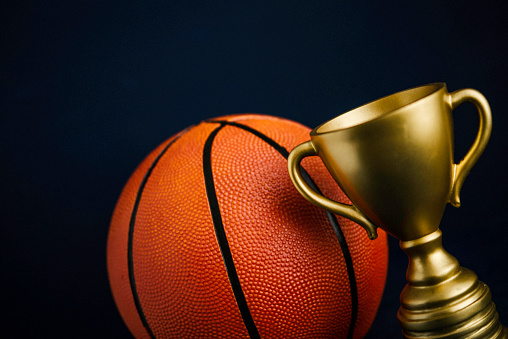 Gold sports trophy with basketball