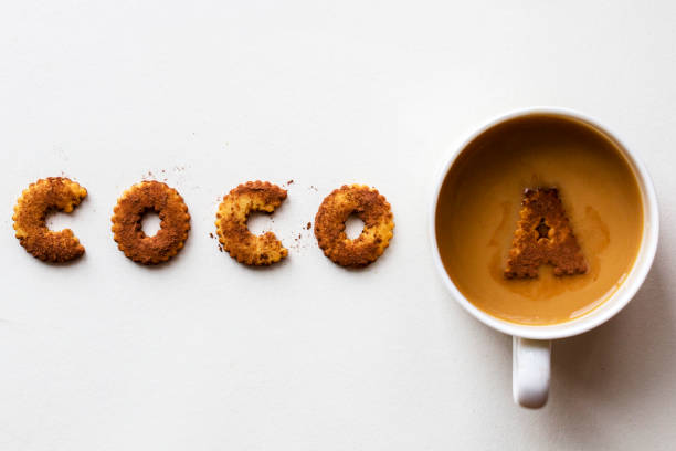 istock word cocoa by alphabet biscuits, arranged with cocoa powder and cocoa drink 846220476