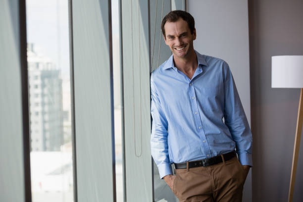 istock Male executive standing with hands in pocket at office 846220516