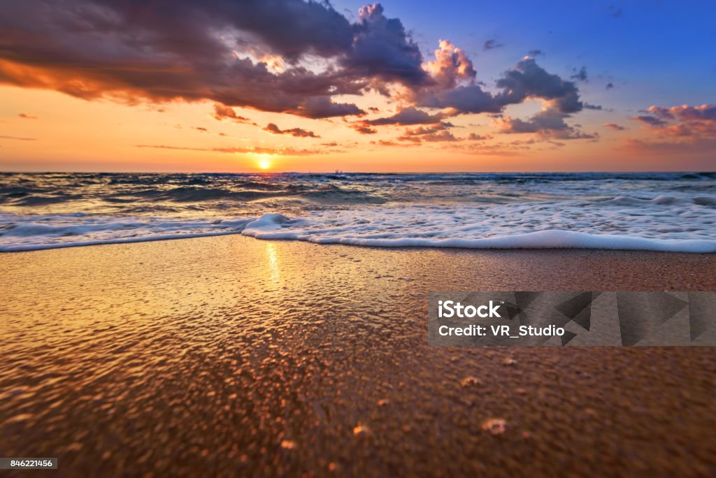 Early morning, sunrise over sea. Golden sands. Beach Stock Photo