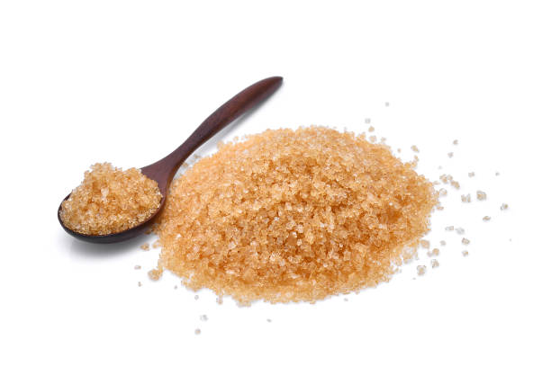 istock brown cane sugar in wooden spoon isolated on white background 846221678