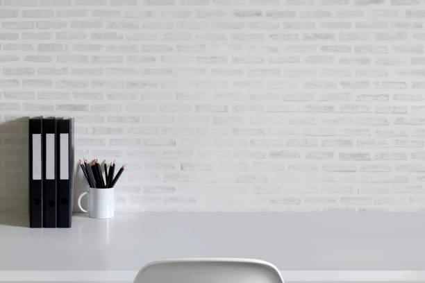 istock Work space Mock up white tabletop with files folder and pencils on white wood desk with copy space for products display montage. 846224844