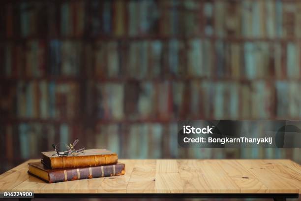 Vintage Books On Table In Library Stock Photo - Download Image Now - Book, Library, Desk