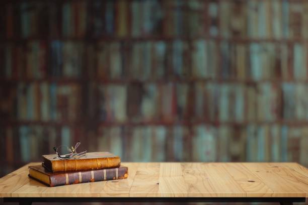 vintage books on table in library. - book school desk old imagens e fotografias de stock