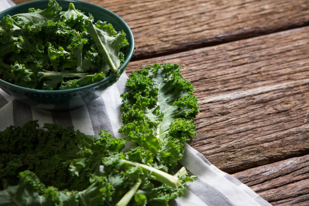 istock Mustard greens on wooden table 846225008