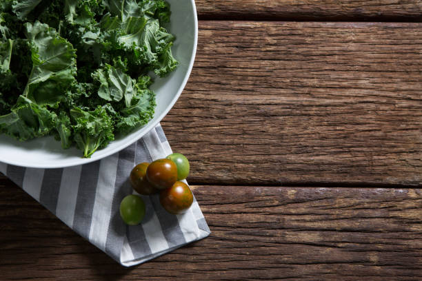 istock Mustard greens and gooseberry on wooden table 846225106
