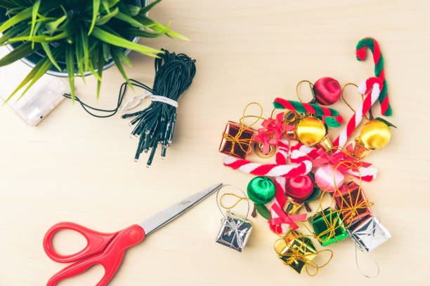 istock christmas decorations stuff on wood table top, top view background 846226400