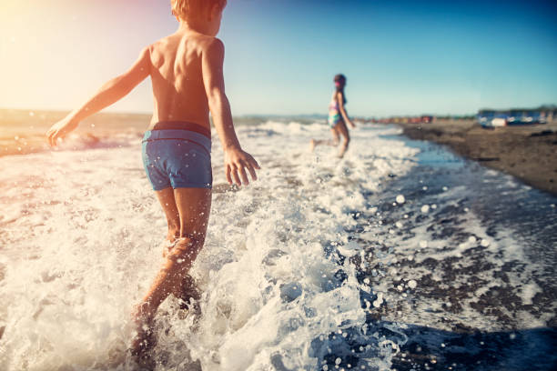 istock Chlidren running on the beach 846235956