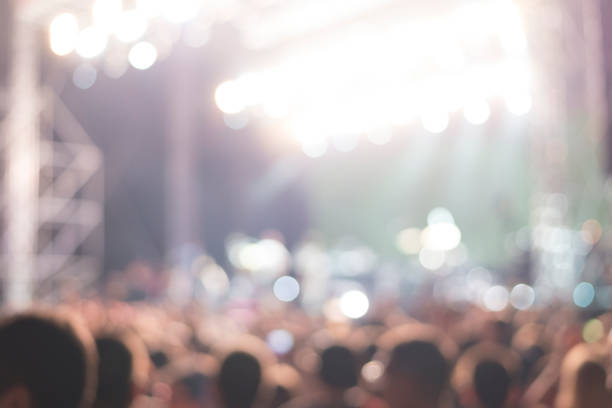 istock people at a concert, abstract blur background 846240298