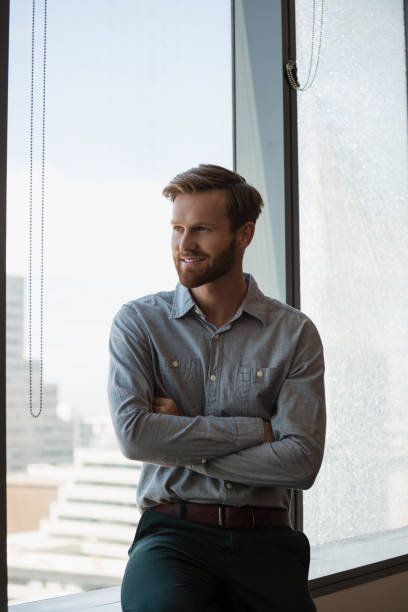 istock Male executive sitting with arms crossed in office 846240972