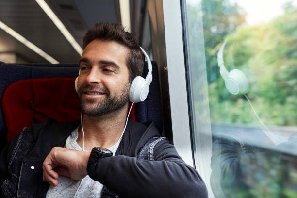 istock Dude with phones on train 846248382