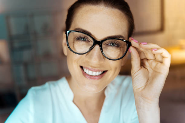 istock Attractive brunette touching her glasses 846250570