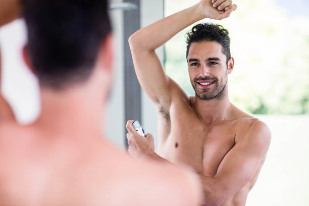 istock Handsome shirtless man putting deodorant 846251198