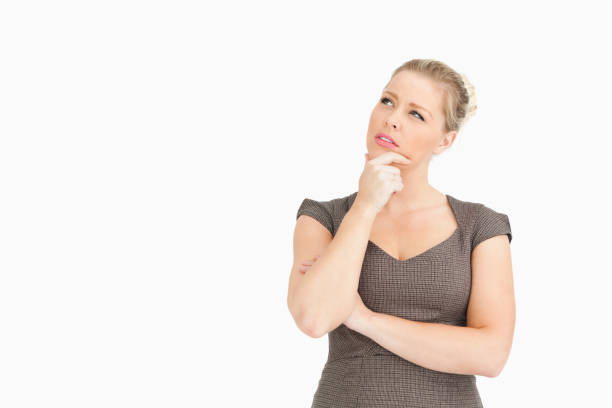 istock Woman thinking with a finger on her face 846255996