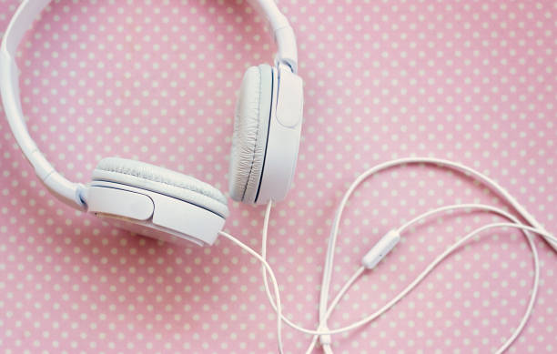 istock White headphones on pink background 846256146