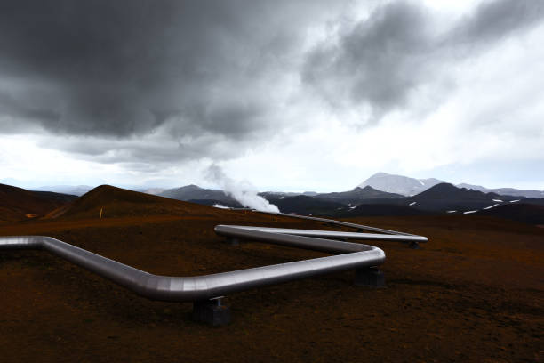 Iceland landscape with pipes in mountains Iceland landscape with pipes in mountains. Geothermal energy in operations geothermal reserve stock pictures, royalty-free photos & images