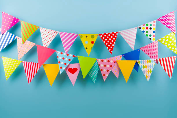 istock Birthday fest garlands from colorful triangular flags on blue background 846262422