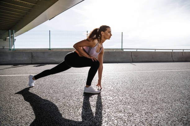 istock Female athlete warming up her legs outdoors 846263224