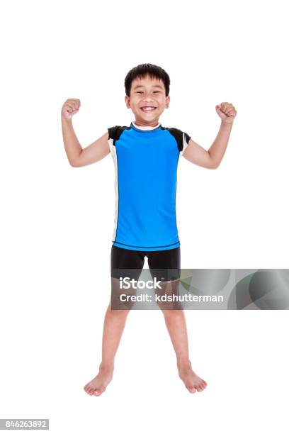 Asian Strong Boy Is Flexing His Biceps Muscle Isolated On White Background Stock Photo - Download Image Now