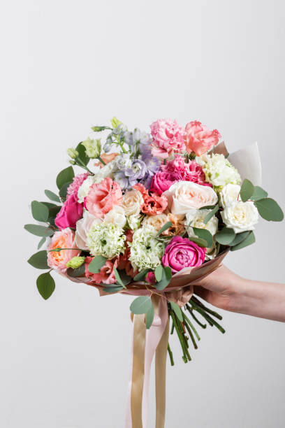 istock Rich bunch flowers in hand Fresh spring bouquet. Summer Background. 846267124