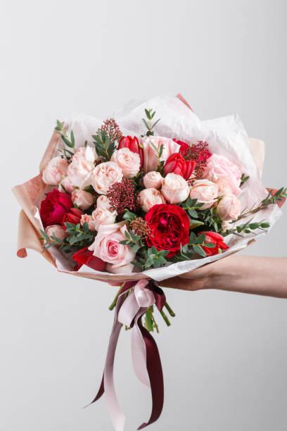 istock Rich bunch flowers in hand Fresh spring bouquet. Summer Background. 846267302