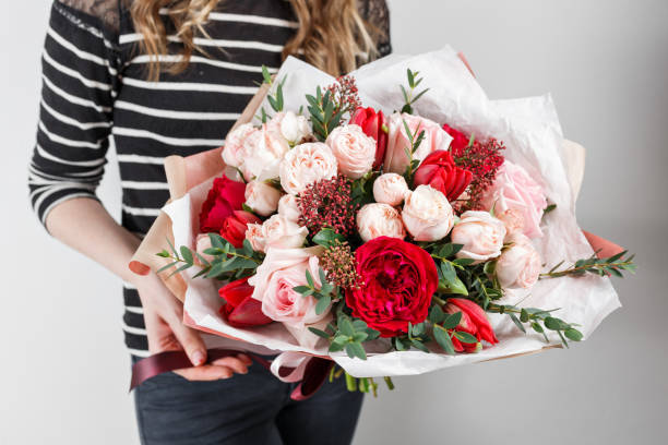 istock Rich bunch flowers in hand Fresh spring bouquet. Summer Background. 846267450