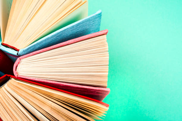 istock Top view of bright colorful hardback books in a circle. 846271032