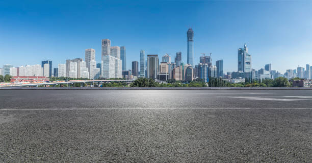 Panoramic beijing skyline and buildings with empty road