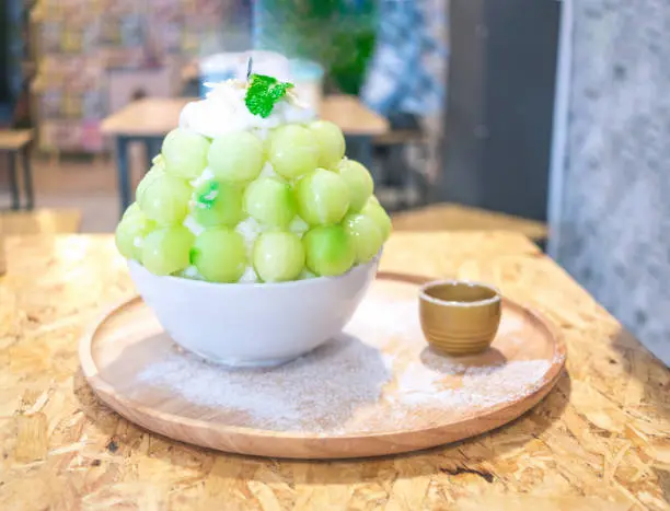 Photo of Green Bingsu melon. Ice crystals dessert