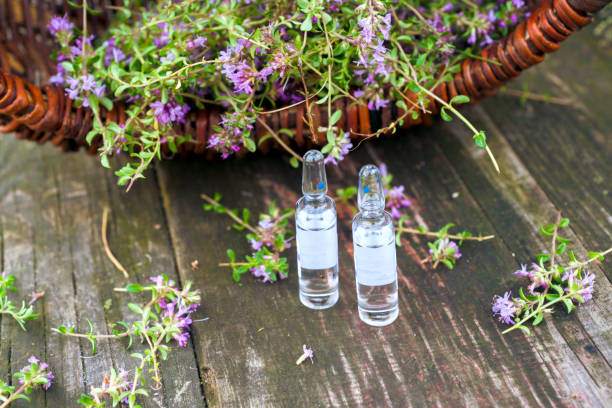 istock Alternative Medicine.Thyme and medical ampoules. Essential oils 846271496
