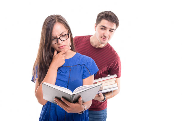 istock Boyfriend reading from girlfriend's book from behind 846271774