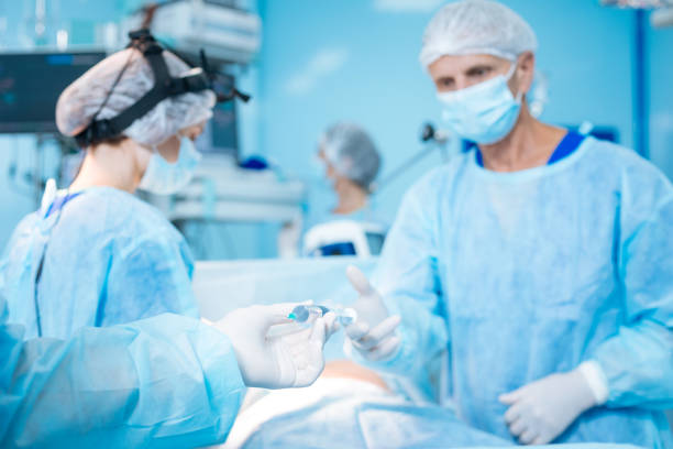 istock Mature medical worker taking instrument 846272316