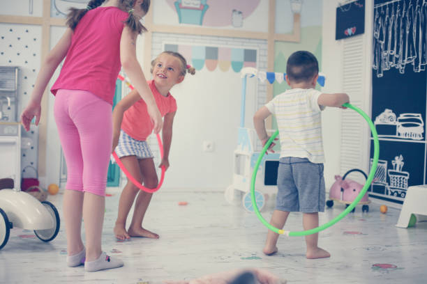 istock Two children in playground. Children spins hoolahope. 846274356