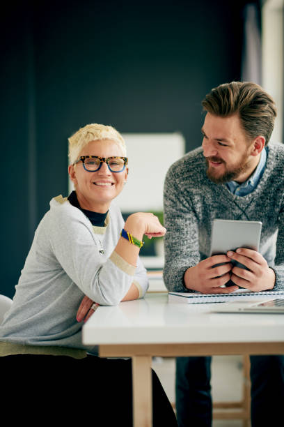istock Businessman helping colleague to solve a problem 846275300