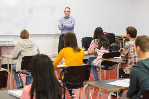 istock Attentive students with teacher in the classroom 846276004