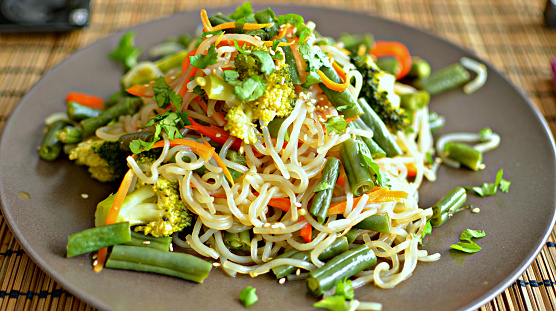 Shirataki noodles and vegetables stir fry on a plate