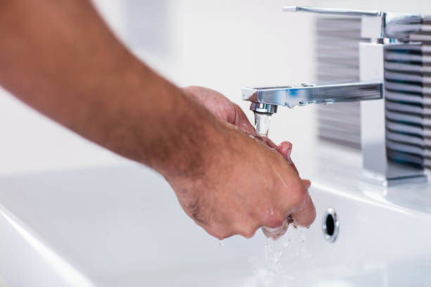 istock Close up of washing hands under running water 846281036