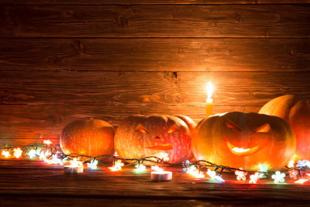 istock Halloween pumpkin head jack lantern on wooden background 846283808