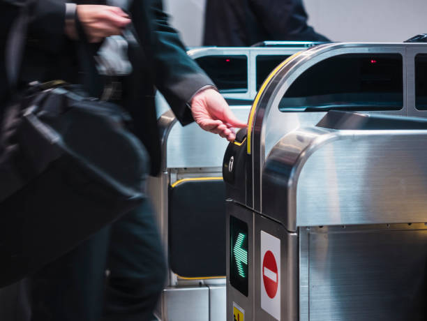 istock People insert ticket to Ticket Entrance at Train station 846284358