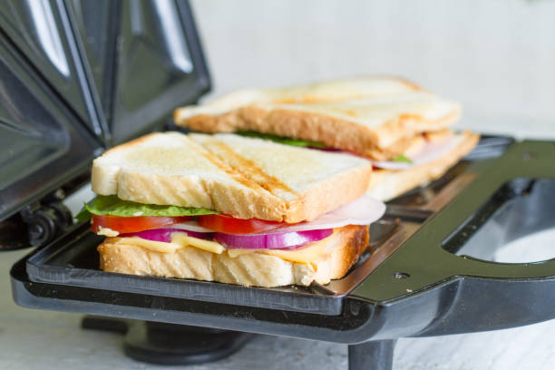istock Sandwich toaster with toast and ingredients 846287948