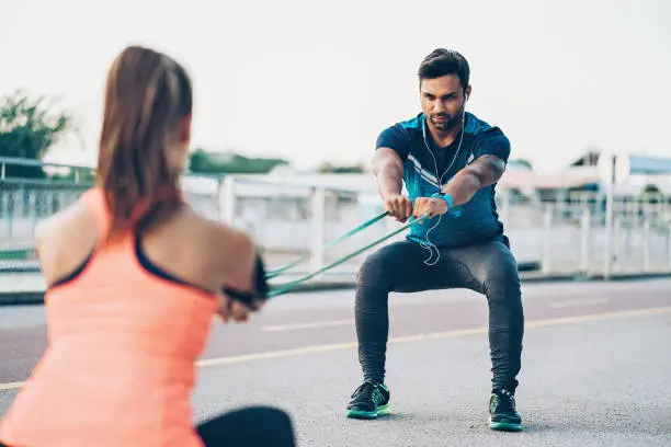 Couple of sportspersons training outdoors