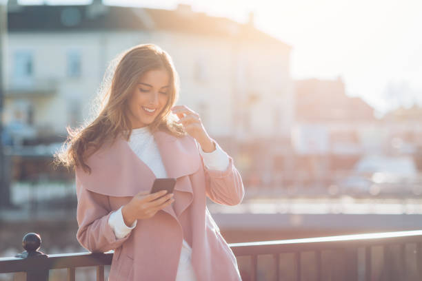 istock Beautiful woman texting at sunlight 846288788