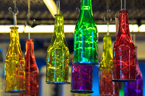 Colorful glass bottle decoration hanging on ceiling.