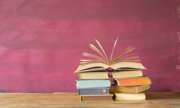 istock open book on red grungy background, 846300580