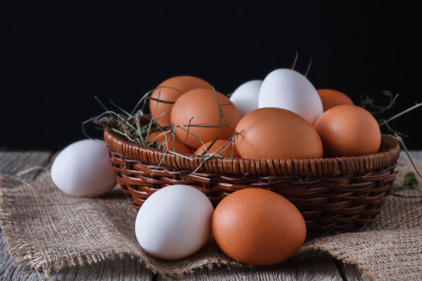 istock Fresh chicken white and brown eggs on sack closeup, organic farming background 846300664
