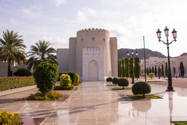 mirrored reflection of the lights of the corniche of muttrah, old town muscat, oman.
