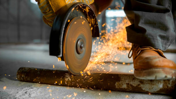 istock Grinder being used to cut through metal pipe on floor 846307168