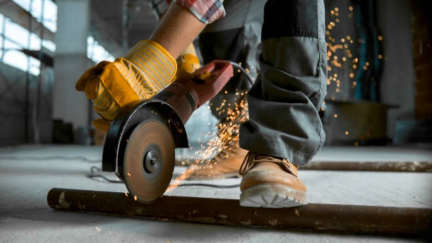 istock Grinder being used to cut through metal pipe on floor 846307180