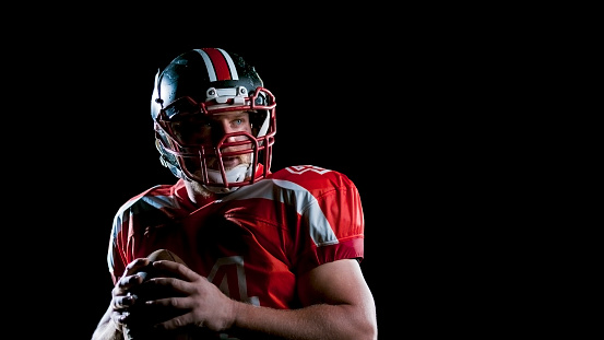 American football player holding a ball royalty-free istock photo